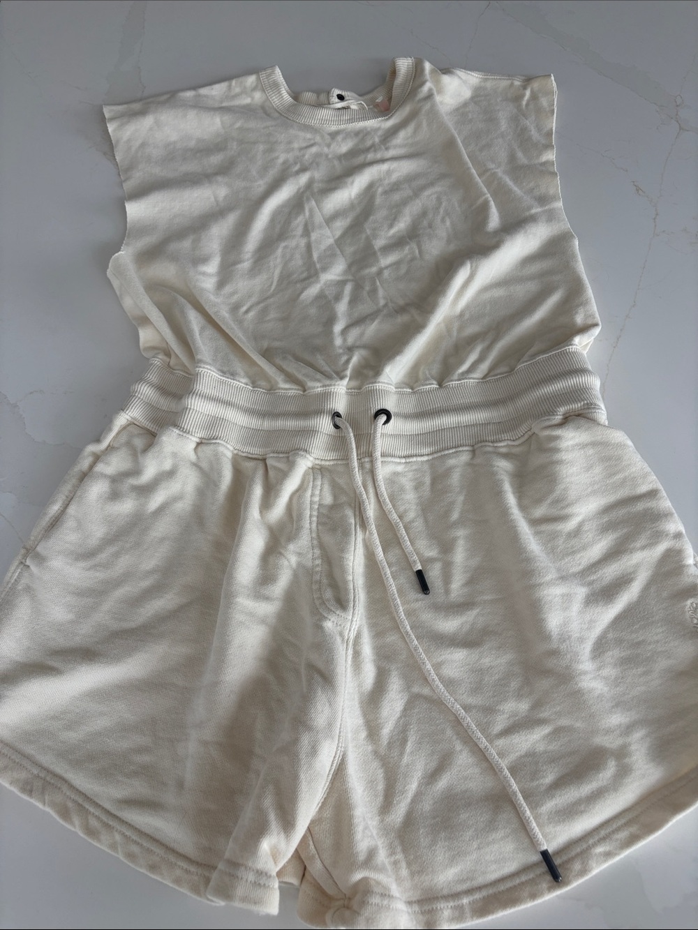 FP Movement by Free People Cream Sleeveless Romper with Drawstring Waist